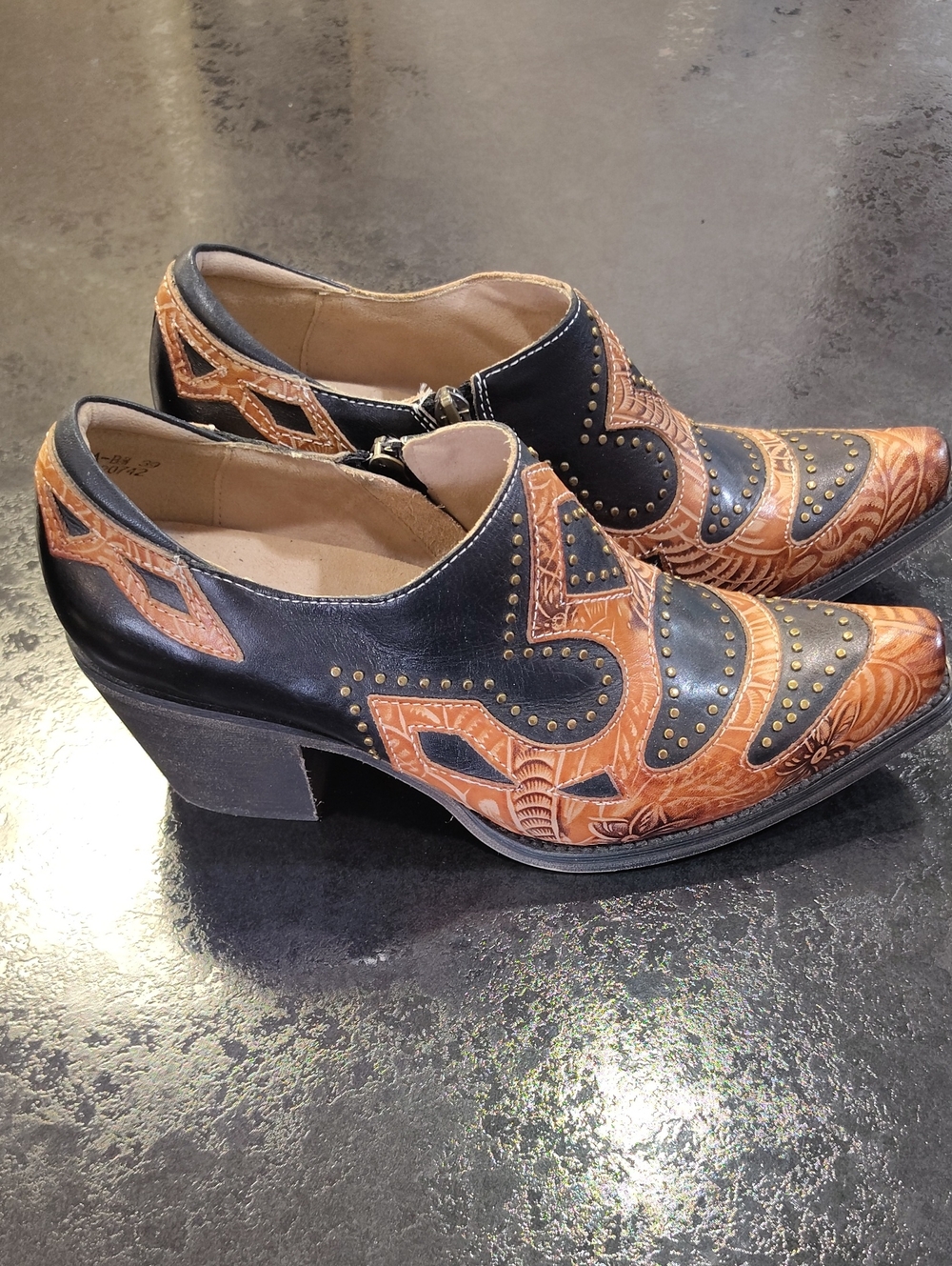 L'ATISTE Black and Tan Western Embossed Heeled Booties